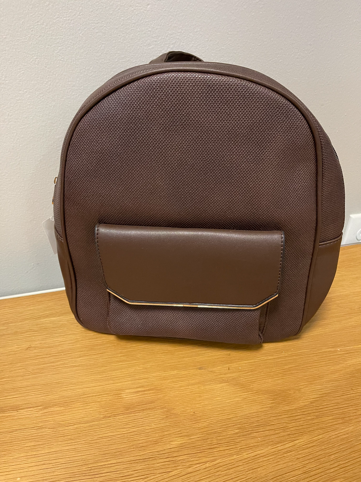 Dark brown backpack with front pocket
